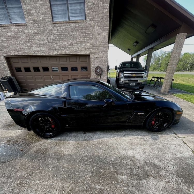 Deep black Corvette Z06 side profile after paint correction