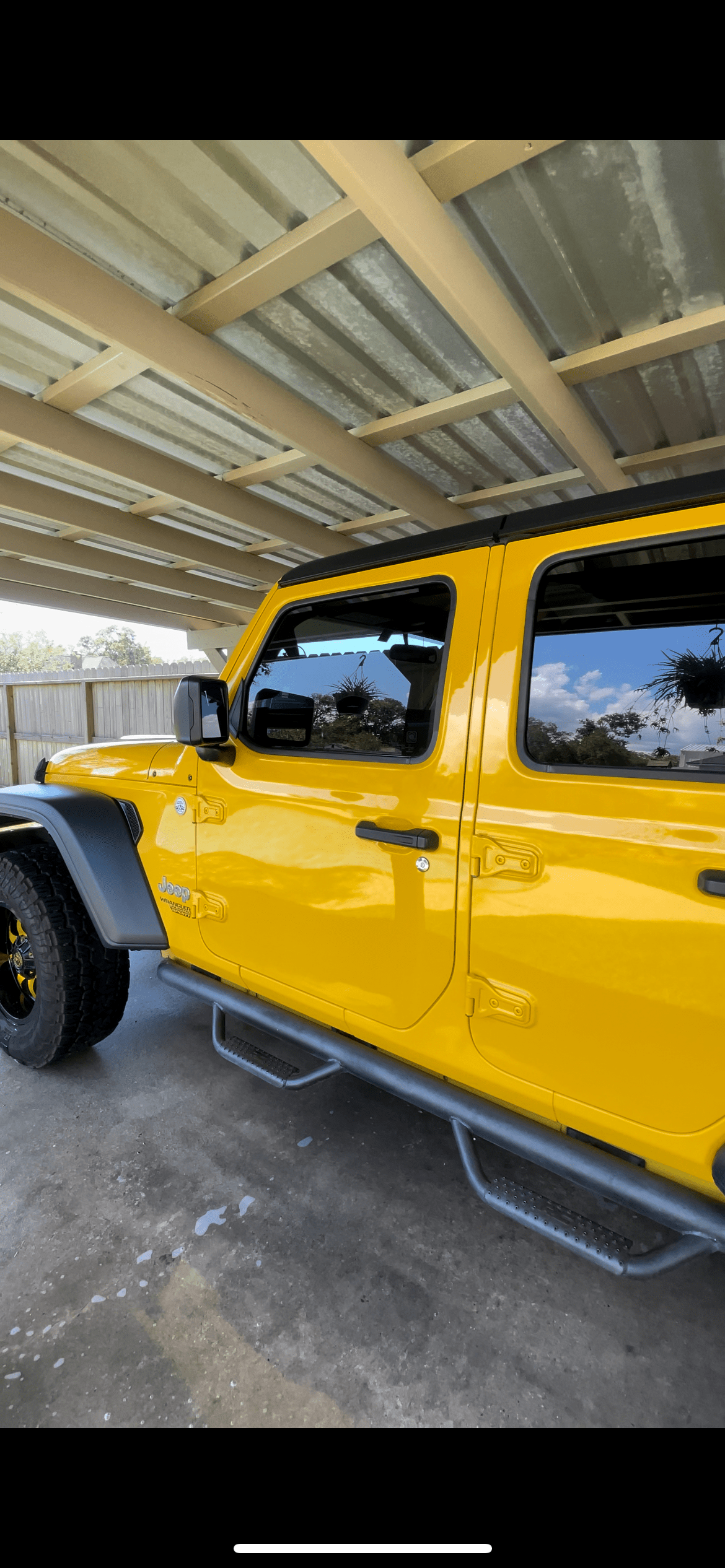 Yellow Jeep Wrangler with a glossy exterior finish